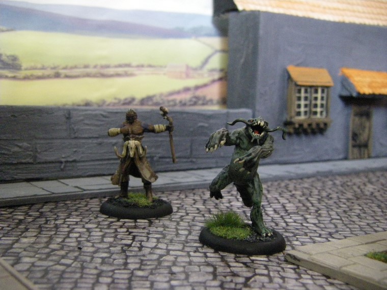  Photos of Marcus and a Silurid in Home made Malifaux City Terrain Painted, Wyrd Games