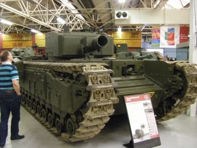 Churchill AVRE 
The Armoured Vehicle Royal Engineers was a Churchill III or IV equipped with the Petard, a 290 mm Spigot mortar, throwing the 40 lb (18 kg) "Flying dustbin" with its 28 pound high explosive warhead; a weapon designed for the quick levelling of fortifications developed by MD1. The petard was reloaded by traversing the turret to the co-driver's hatch
