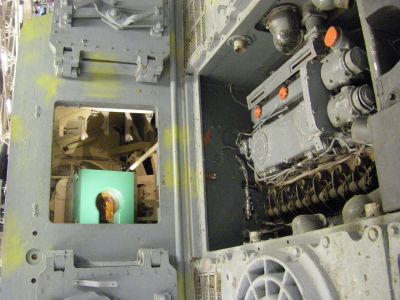 JagdTiger rear hatch view of interior
The Jagdtiger was the heaviest armored fighting vehicle operationally used during World War II. The vehicle carried a 128 mm PaK 44 L/55 main gun, capable of out-ranging and defeating any fielded Allied tank. It saw service in small numbers from late 1944 to the end of the war on both the Western and Eastern Front. Tiger ace Otto Carius commanded a company of Jagdtigers. His post-war memoir provides a rare combat history of the Jagdtigers which had been under his command. Although 150 were ordered, only between 77 to 88 were produced. Due to an excessive weight the Jagdtiger was continuously plagued with mechanical problems. Today, three Jagdtigers survive in museums.
