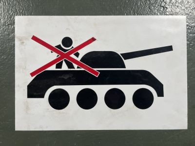 Don't climb on the tank sign
