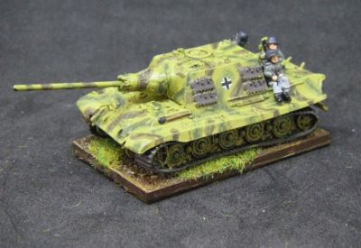 Jagdtiger
Sadly this model melted a bit when I dipped it in paint stripper, and I had to do a botch job repair of the barrel and mantlet. The tank riders are from Arrowhead
