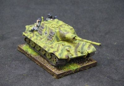 Jagdtiger
Sadly this model melted a bit when I dipped it in paint stripper, and I had to do a botch job repair of the barrel and mantlet. The tank riders are from Arrowhead
